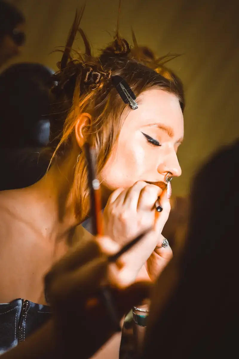 Intimate backstage makeup moment