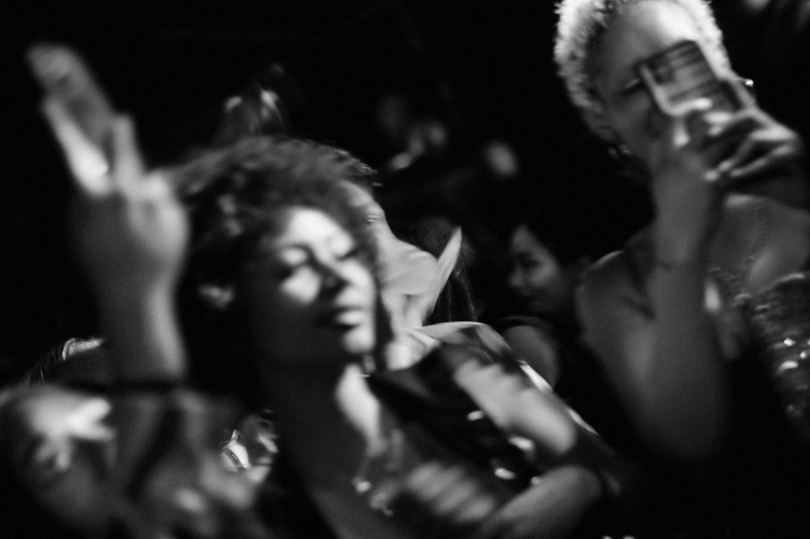 Black-and-white nightlife crowd scene